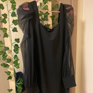 Fitted black dress with long mesh sleeves